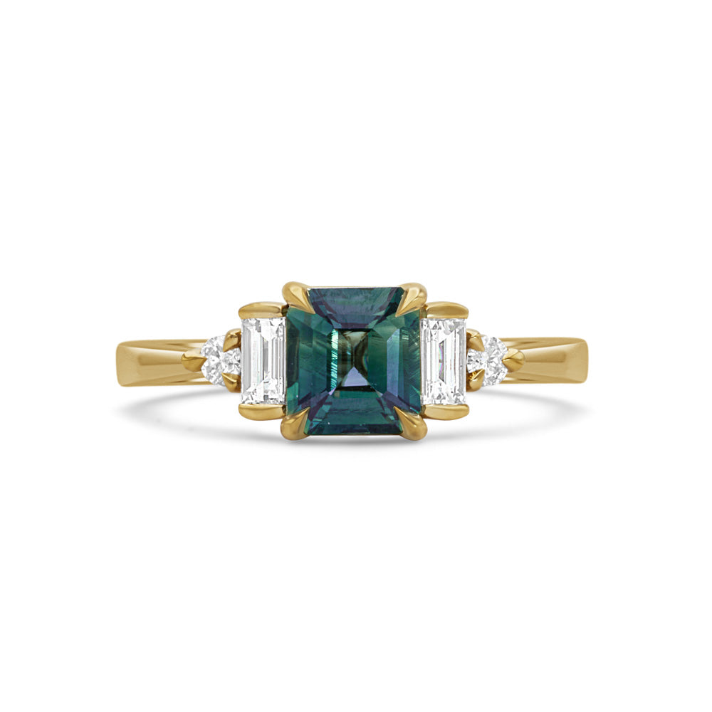 Fine jewellery ring featuring a teal sapphire and diamond accents, crafted in Scotland by Moira Patience