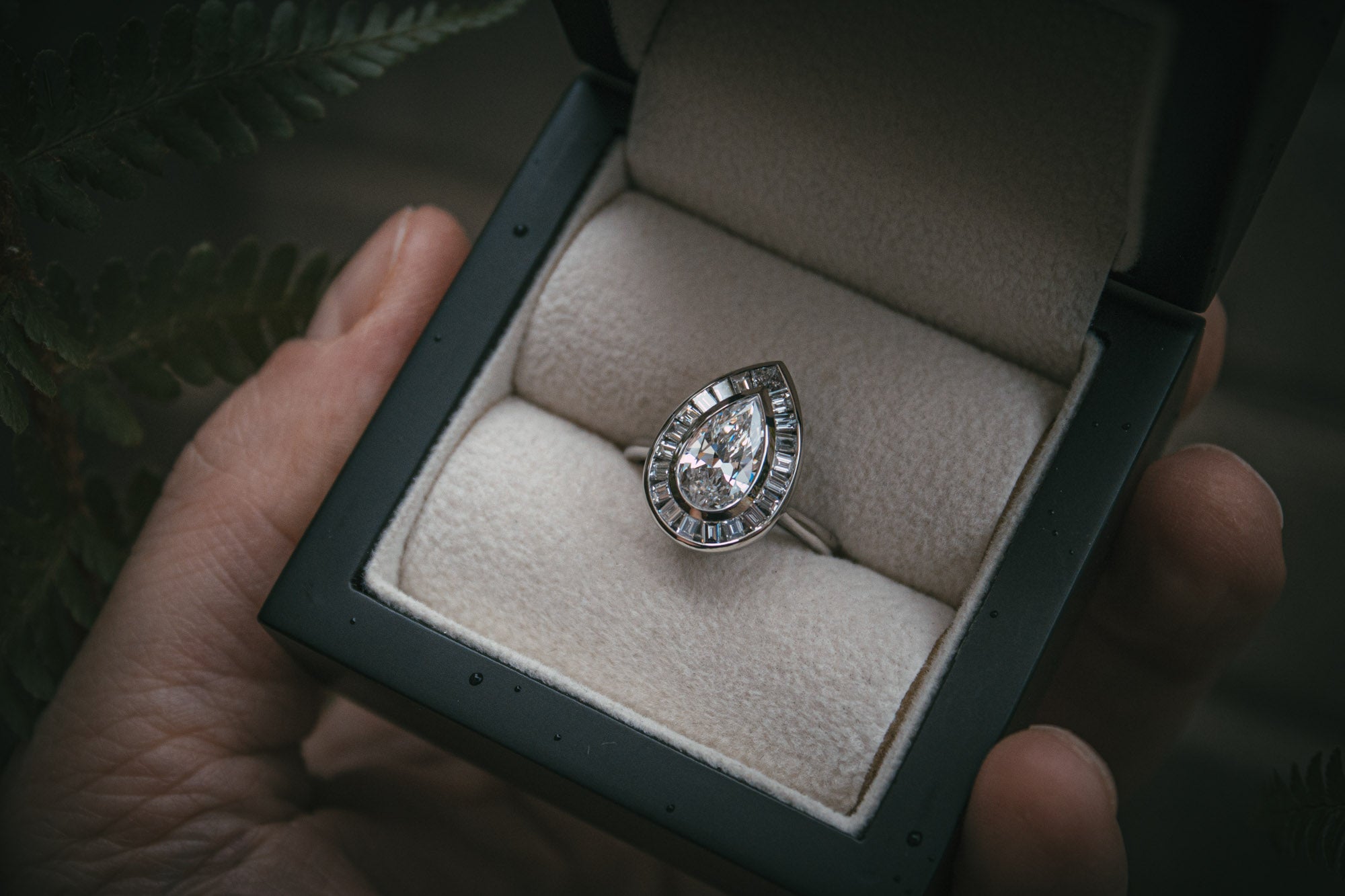 Bespoke pear shaped diamond halo ring