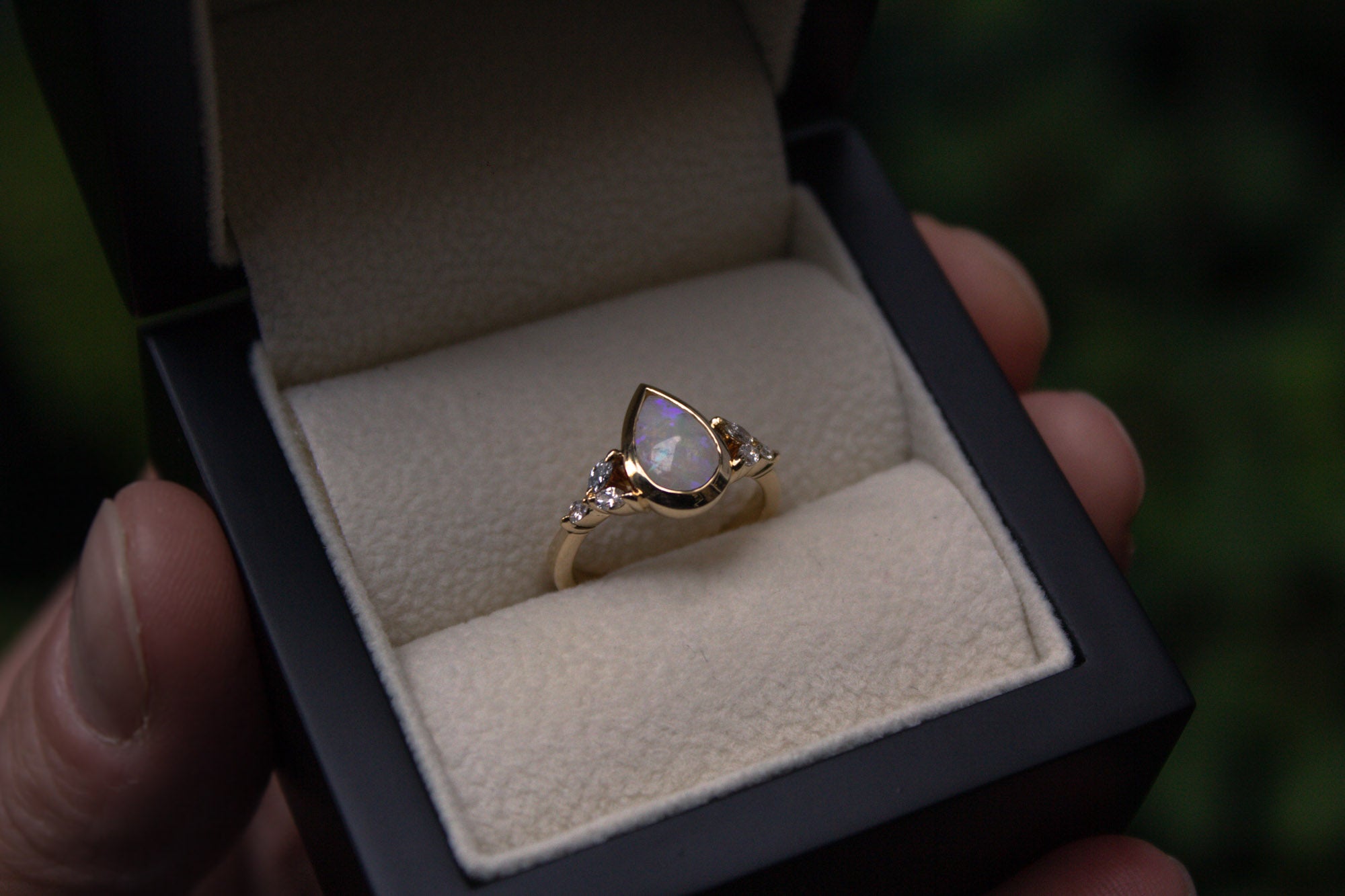 Bespoke oval and diamond engagement ring