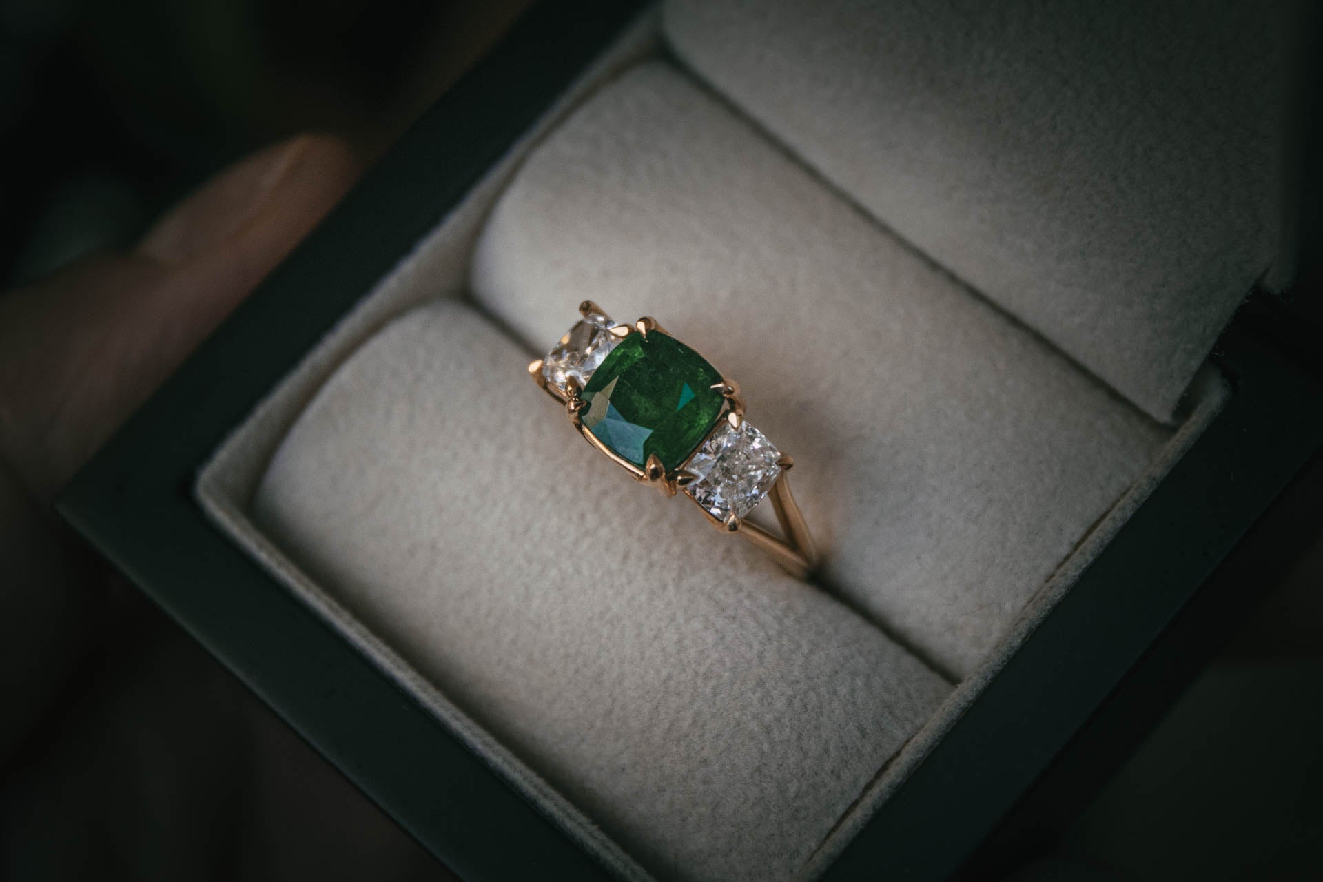 Bespoke emerald and diamond trilogy engagement ring