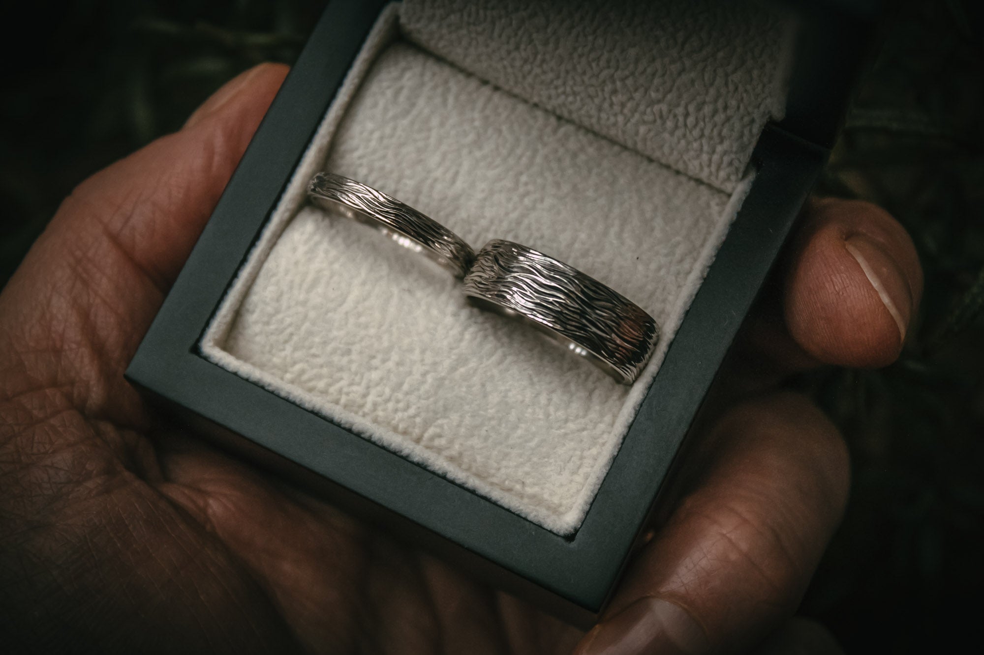 Bespoke wave hand engraved platinum wedding rings