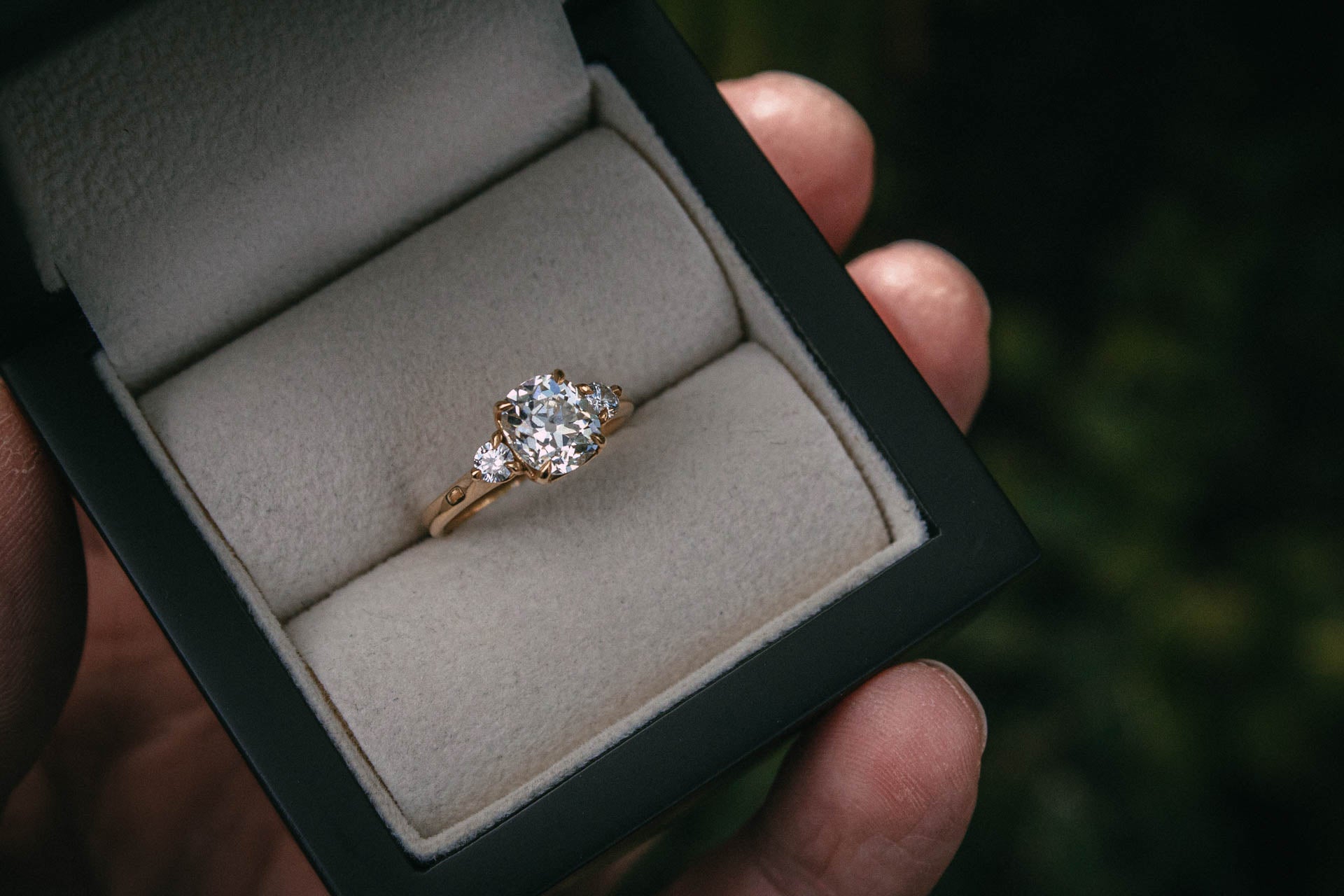Bespoke old mine cut diamond trilogy engagement ring