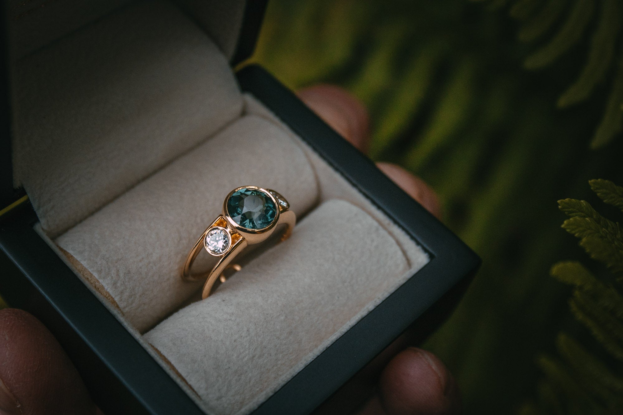Bespoke teal sapphire and diamond engagement ring