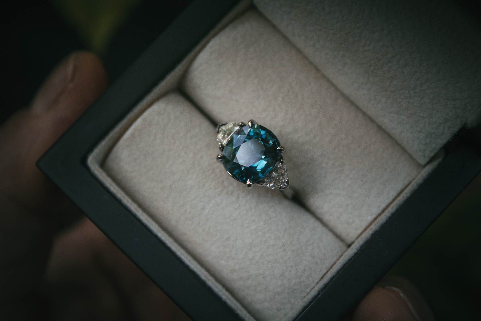 Bespoke natural teal sapphire and diamond gemstone engagement ring