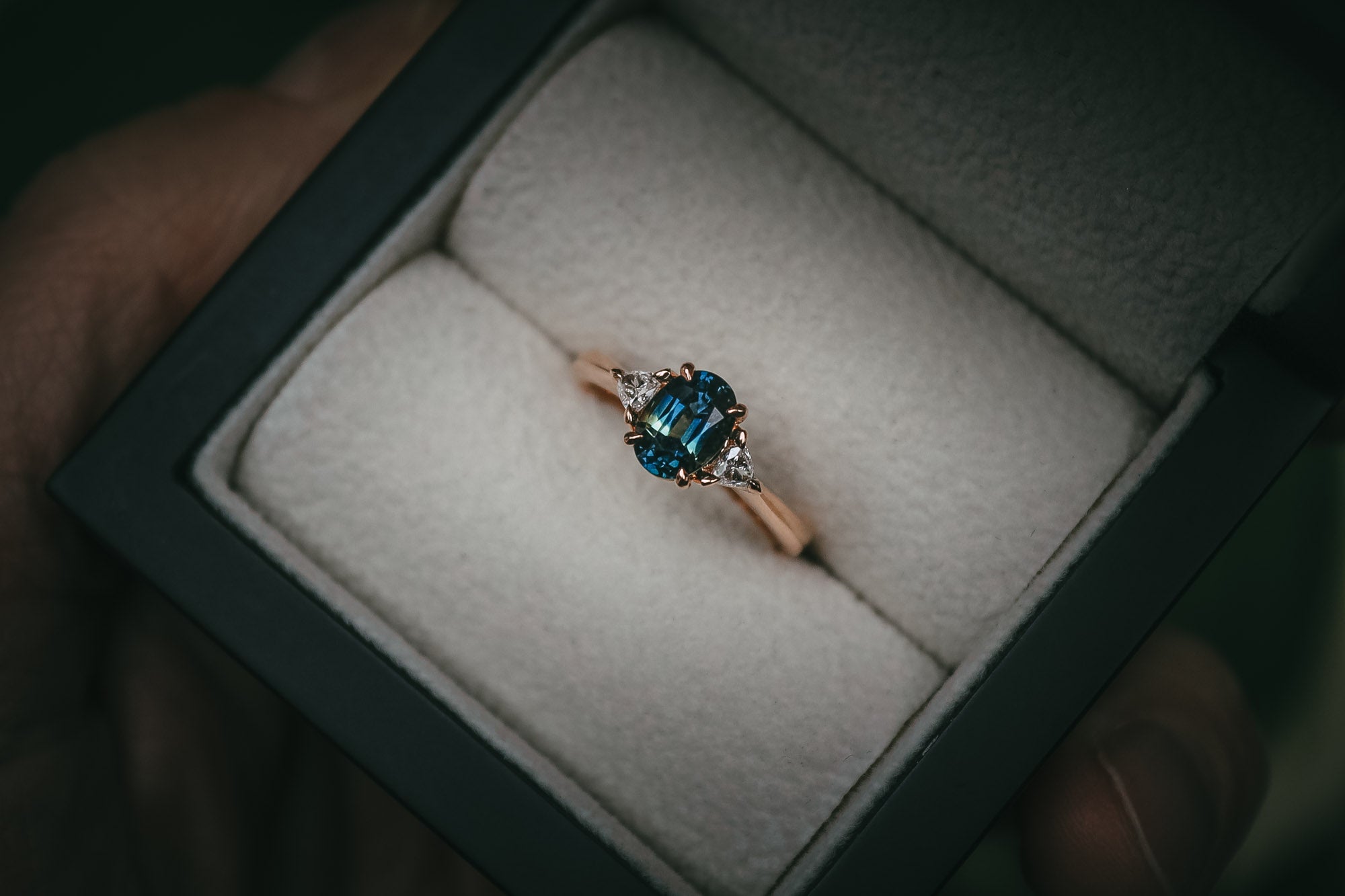 Bespoke teal sapphire and diamond engagement ring