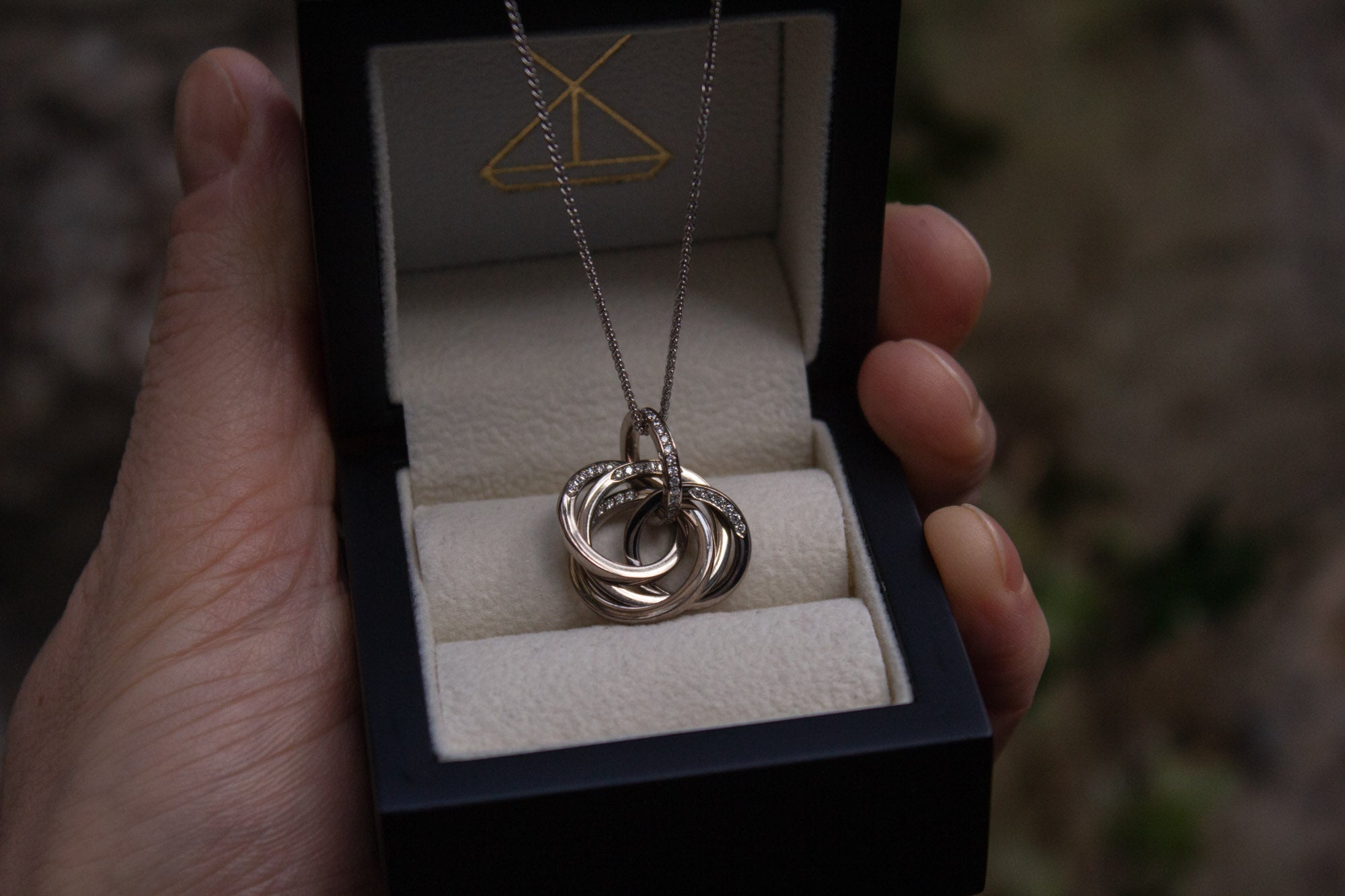 Bespoke white gold engraved pendant