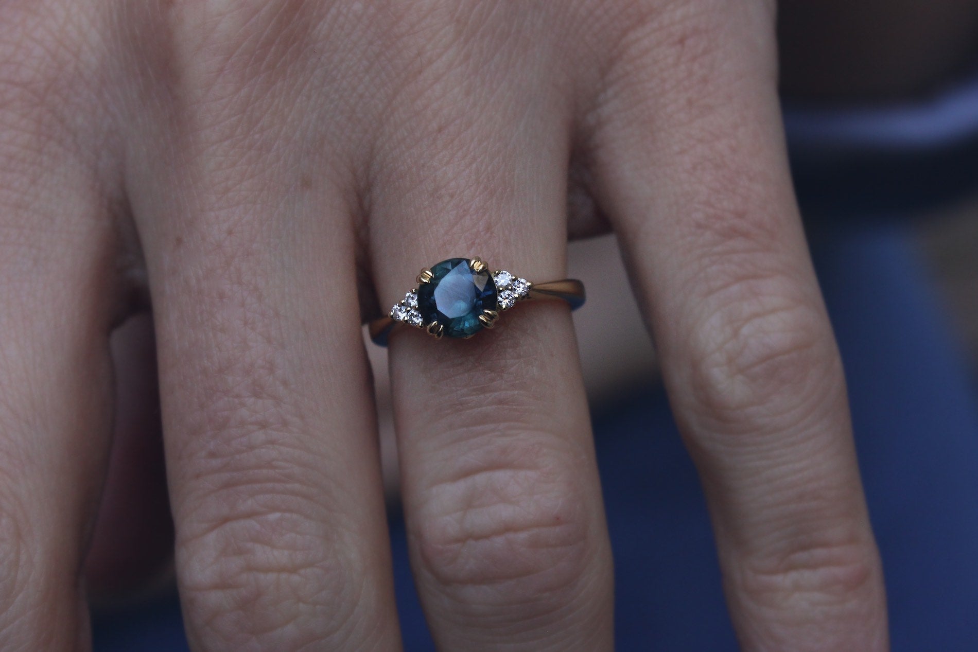 Teal Sapphire Engagement Ring with Diamond Detailing