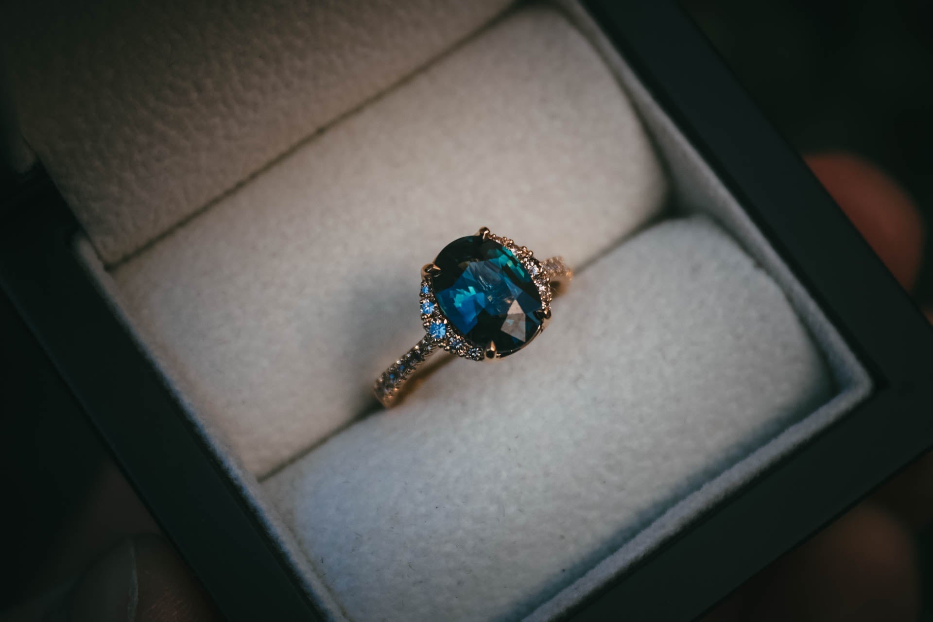 Bespoke teal sapphire and champagne diamond engagement ring