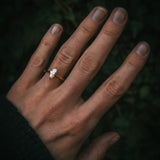 Uist natural marquise diamond solitaire ring on hand; warm white N colour diamond