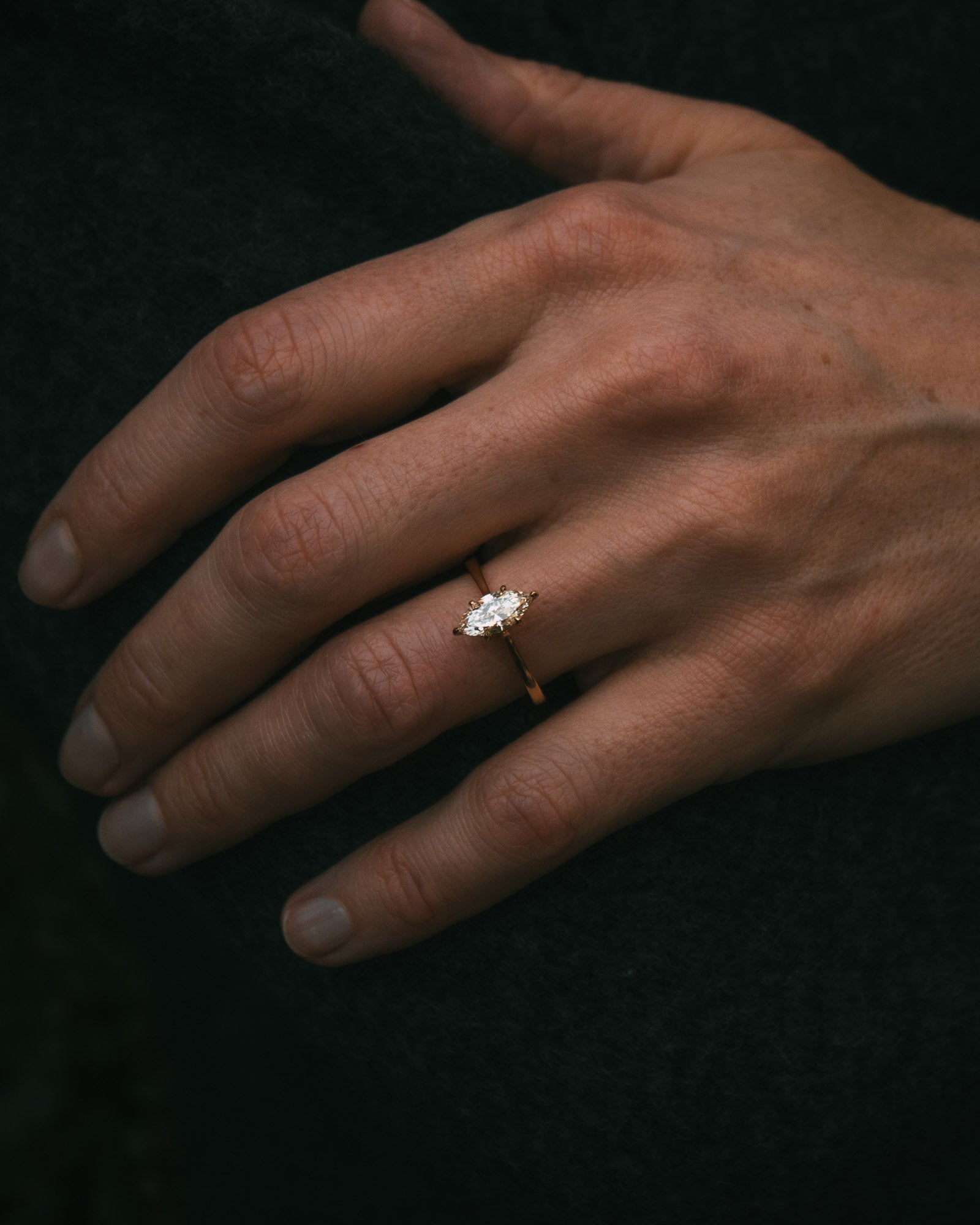 Uist natural marquise diamond solitaire ring on hand; Arc setting