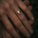 Uist marquise diamond solitaire ring on hand; warm white natural diamond