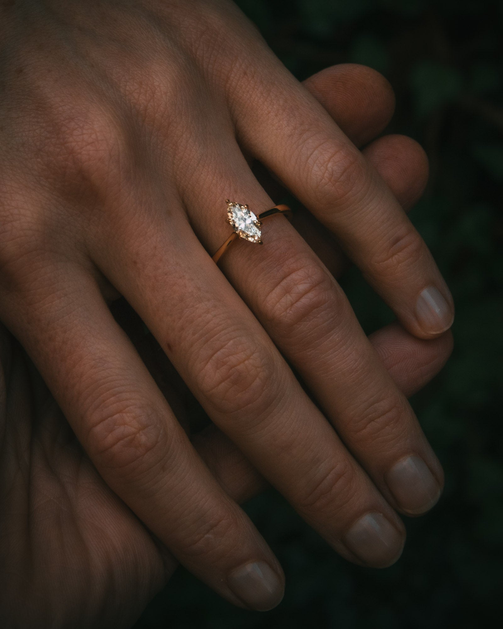 Uist marquise diamond solitaire ring on hand; warm white natural diamond