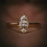 Uist marquise natural diamond solitaire ring in 18ct yellow gold; detail in hand