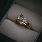 Fara ring set an asymmetric peach topaz engagement ring paired with a fitted diamond wedding ring by Moira Patience Fine Jewellery
