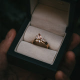 Fara ring set an asymmetric peach topaz engagement ring paired with a fitted diamond wedding ring by Moira Patience Fine Jewellery