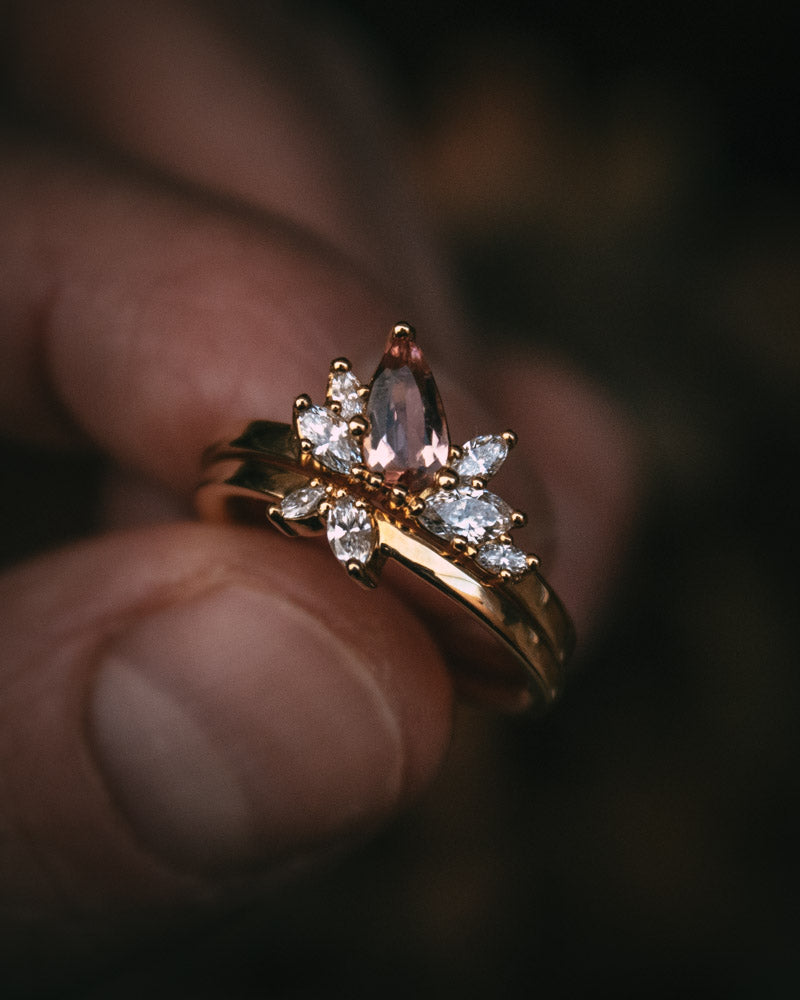Fara ring set an asymmetric peach topaz engagement ring paired with a fitted diamond wedding ring by Moira Patience Fine Jewellery
