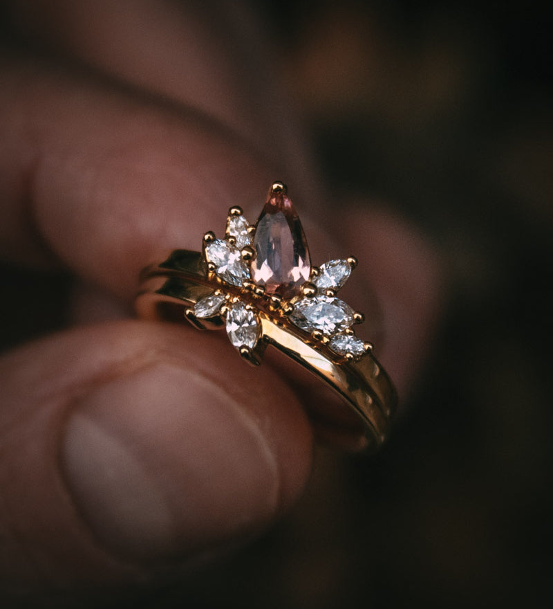 Fara ring set an asymmetric peach topaz engagement ring paired with a fitted diamond wedding ring by Moira Patience Fine Jewellery