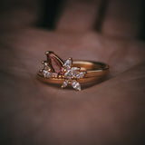 Fara ring set an asymmetric peach topaz engagement ring paired with a fitted diamond wedding ring by Moira Patience Fine Jewellery