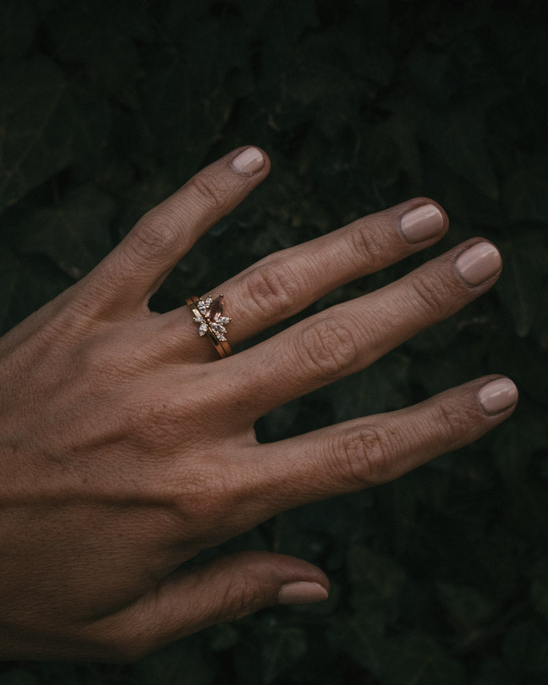 Fara ring set an asymmetric peach topaz engagement ring paired with a fitted diamond wedding ring by Moira Patience Fine Jewellery