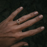 Fara ring set an asymmetric peach topaz engagement ring paired with a fitted diamond wedding ring by Moira Patience Fine Jewellery