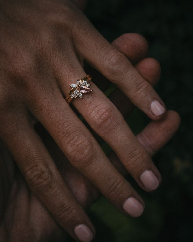 Fara ring set an asymmetric peach topaz engagement ring paired with a fitted diamond wedding ring by Moira Patience Fine Jewellery