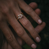 Fara ring set an asymmetric peach topaz engagement ring paired with a fitted diamond wedding ring by Moira Patience Fine Jewellery