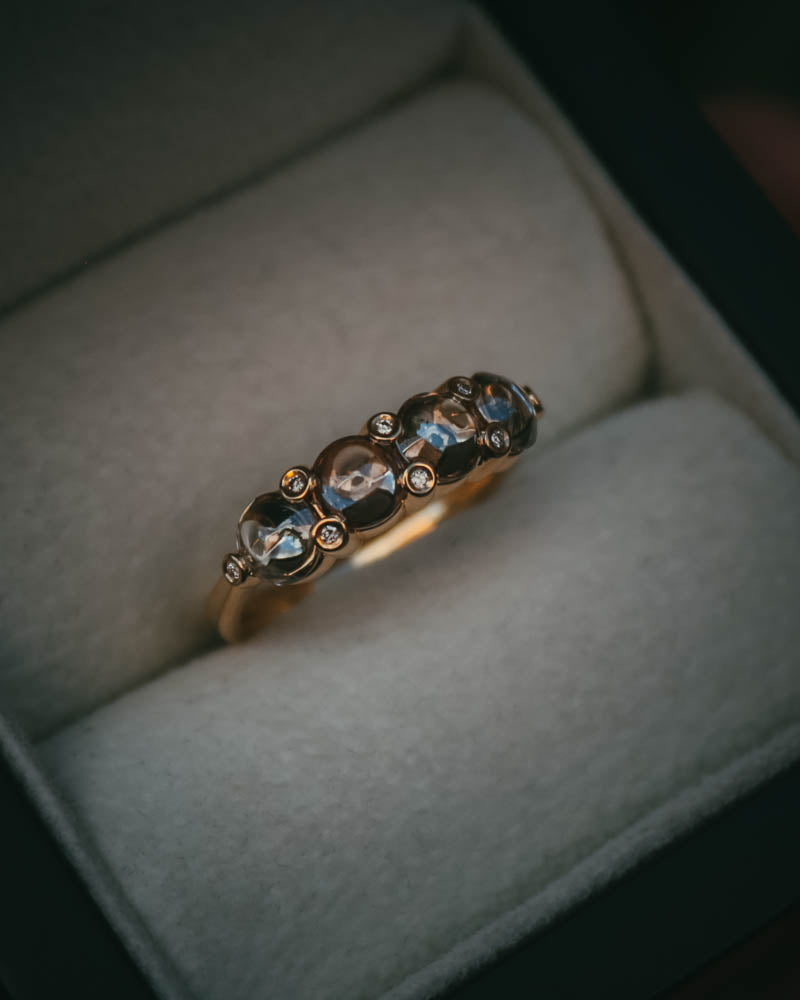 Fótla ring in 18ct yellow gold with four natural champagne diamond cabochons and white diamond accents