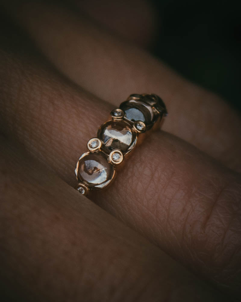 Fótla ring in 18ct yellow gold with four natural champagne diamond cabochons and white diamond accents