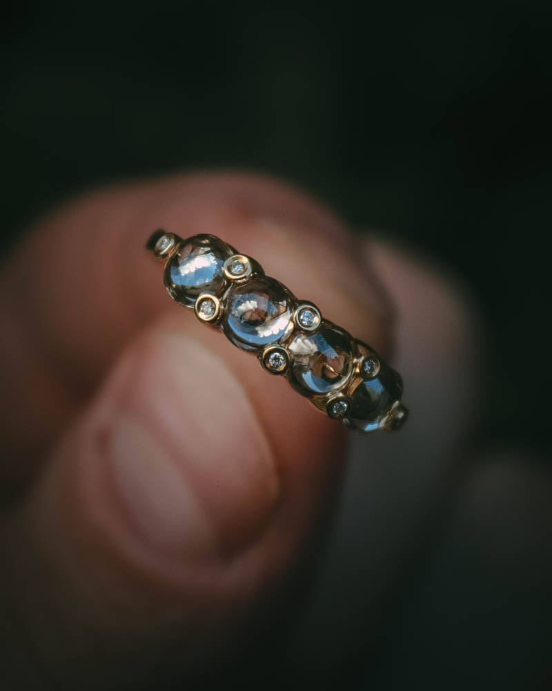 Fótla ring in 18ct yellow gold with four natural champagne diamond cabochons and white diamond accents