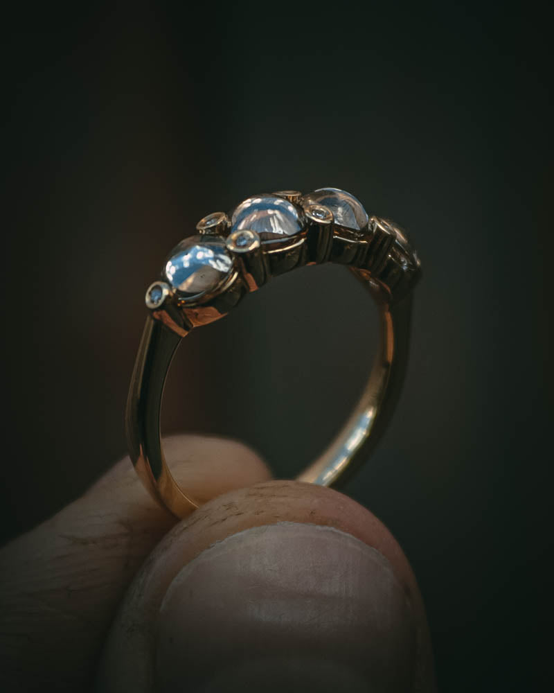 Fótla ring in 18ct yellow gold with four natural champagne diamond cabochons and white diamond accents