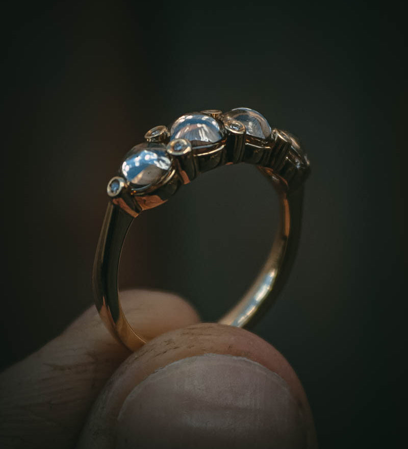 Fótla ring in 18ct yellow gold with four natural champagne diamond cabochons and white diamond accents