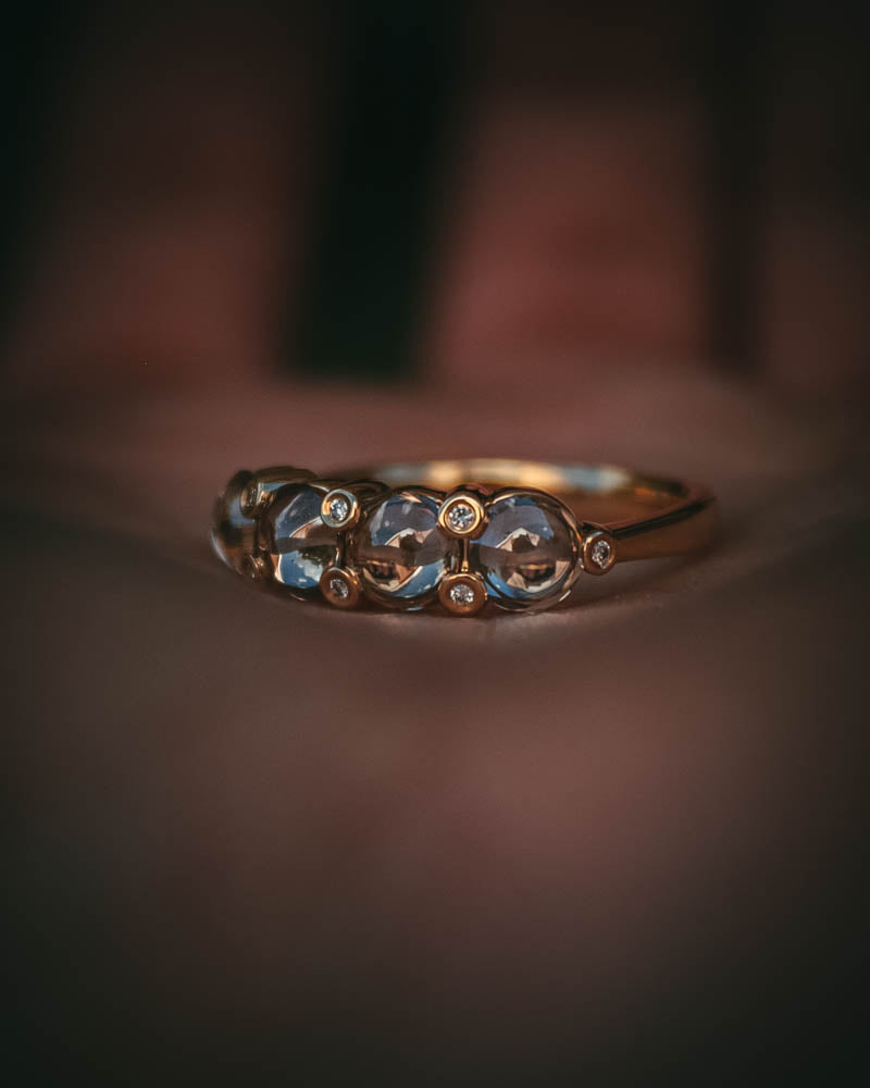 Fótla ring in 18ct yellow gold with four natural champagne diamond cabochons and white diamond accents