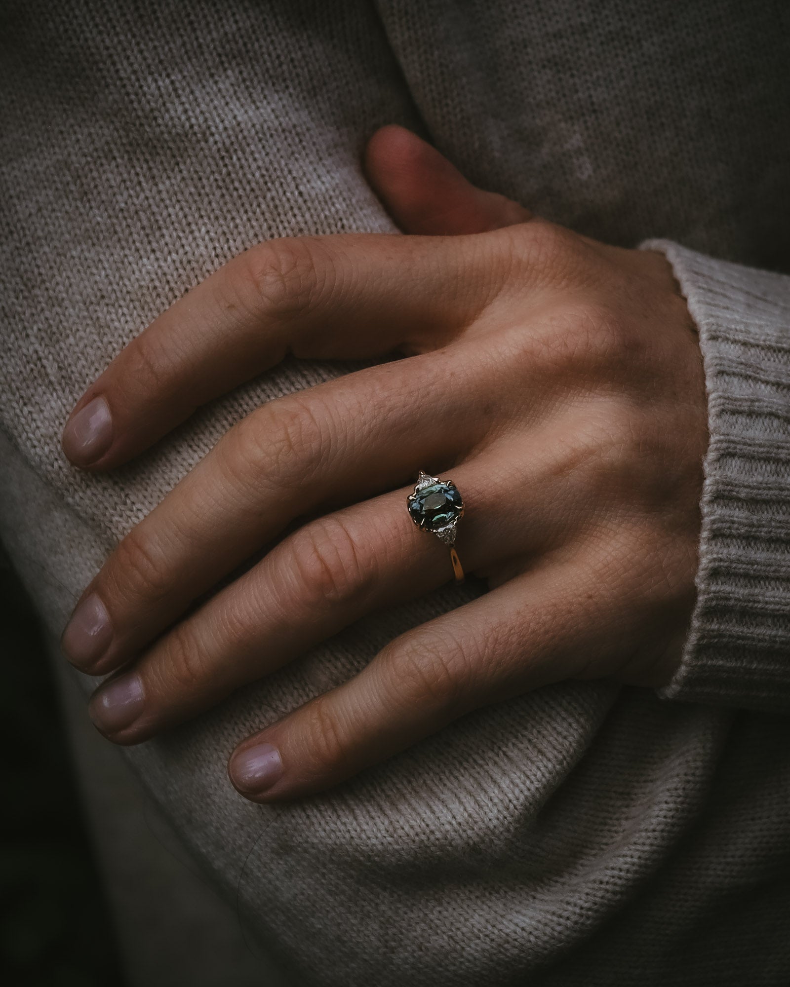 Natural unheated teal sapphire engagement ring proportion on hand