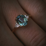 Natural unheated teal sapphire engagement ring proportion on hand