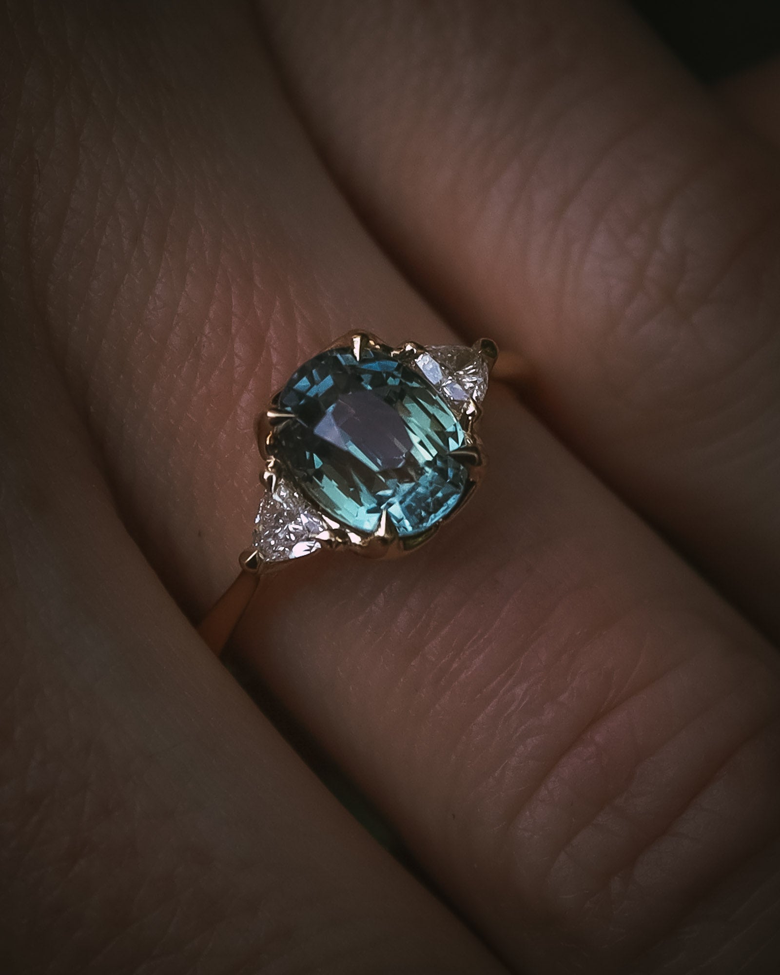 Natural unheated teal sapphire engagement ring proportion on hand