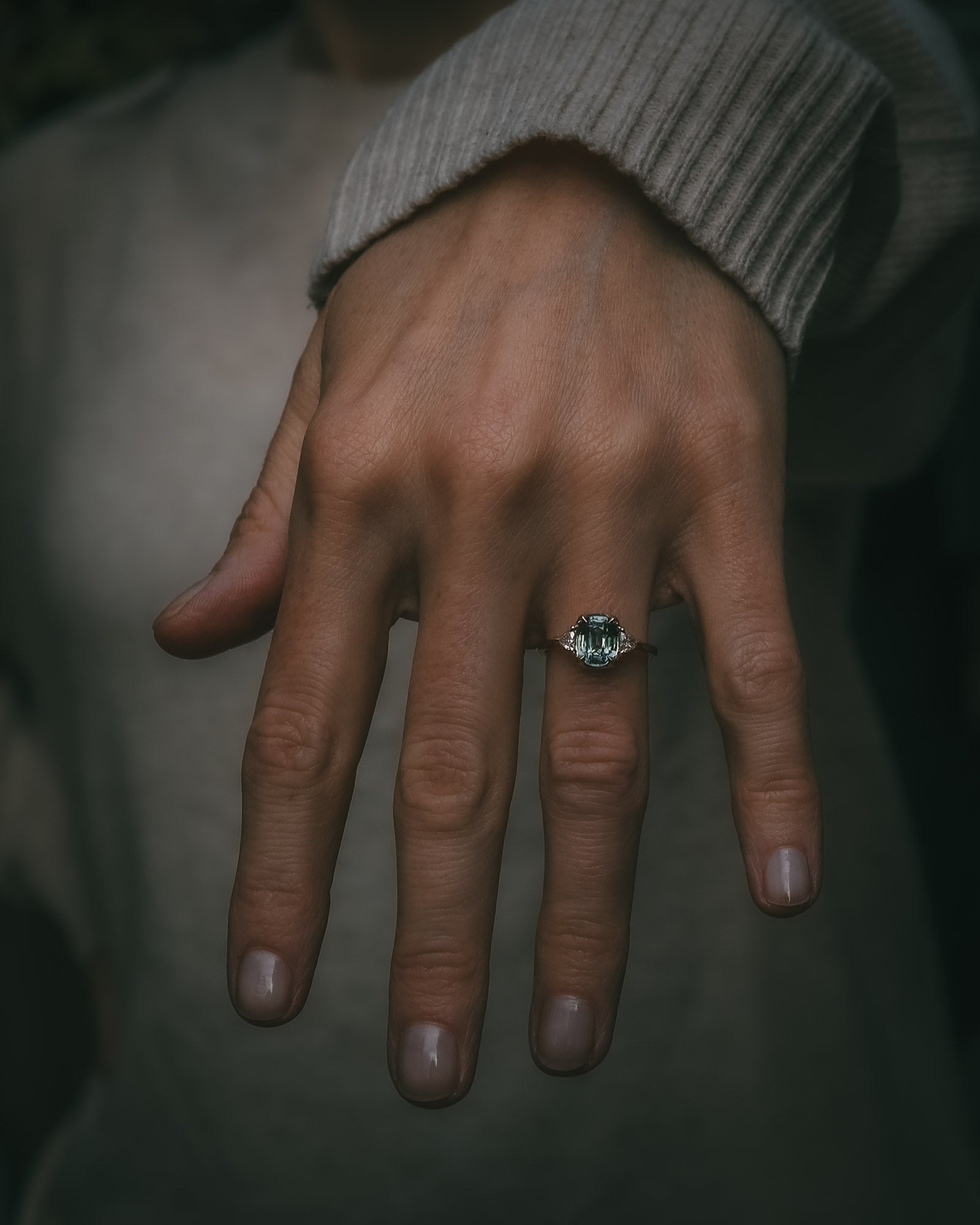Moira Patience Fine Jewellery teal sapphire engagement ring on hand
