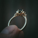 Fine jewellery ring featuring a teal sapphire and diamond accents, crafted in Scotland by Moira Patience