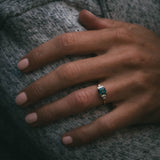 Fine jewellery ring featuring a teal sapphire and diamond accents, crafted in Scotland by Moira Patience