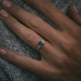 Fine jewellery ring featuring a teal sapphire and diamond accents, crafted in Scotland by Moira Patience