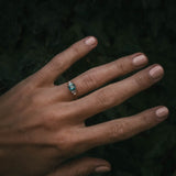 Fine jewellery ring featuring a teal sapphire and diamond accents, crafted in Scotland by Moira Patience