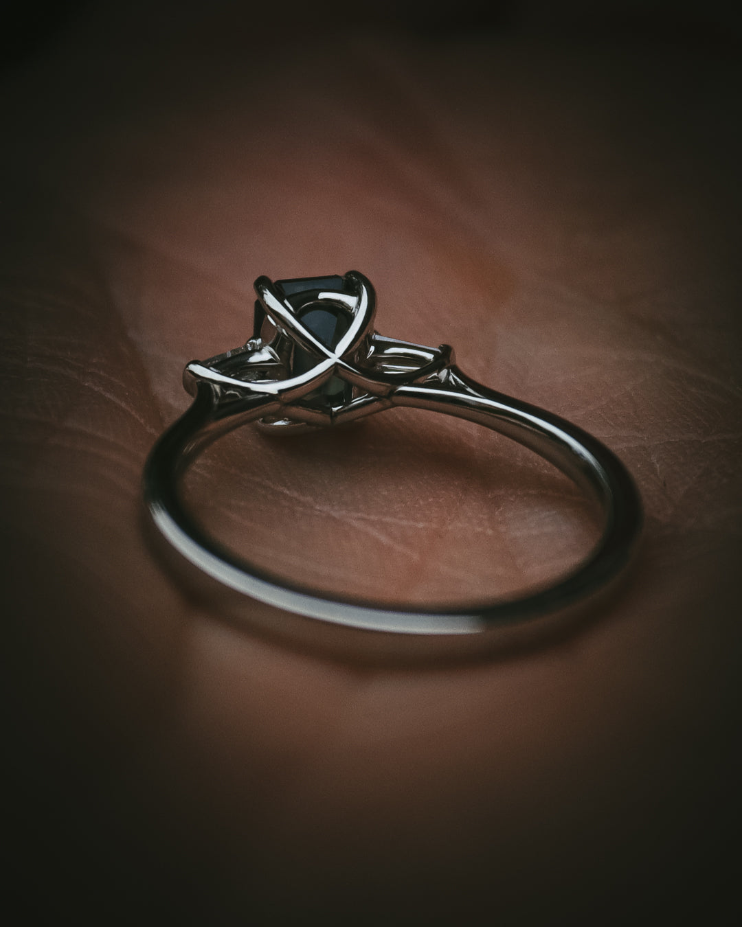 Sròn octagon step-cut teal sapphire ring Arc setting detail