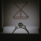 Sròn octagon step-cut teal sapphire ring Arc setting profile detail