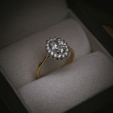 Flùr oval diamond cluster ring in 18ct yellow gold and platinum; front view in box