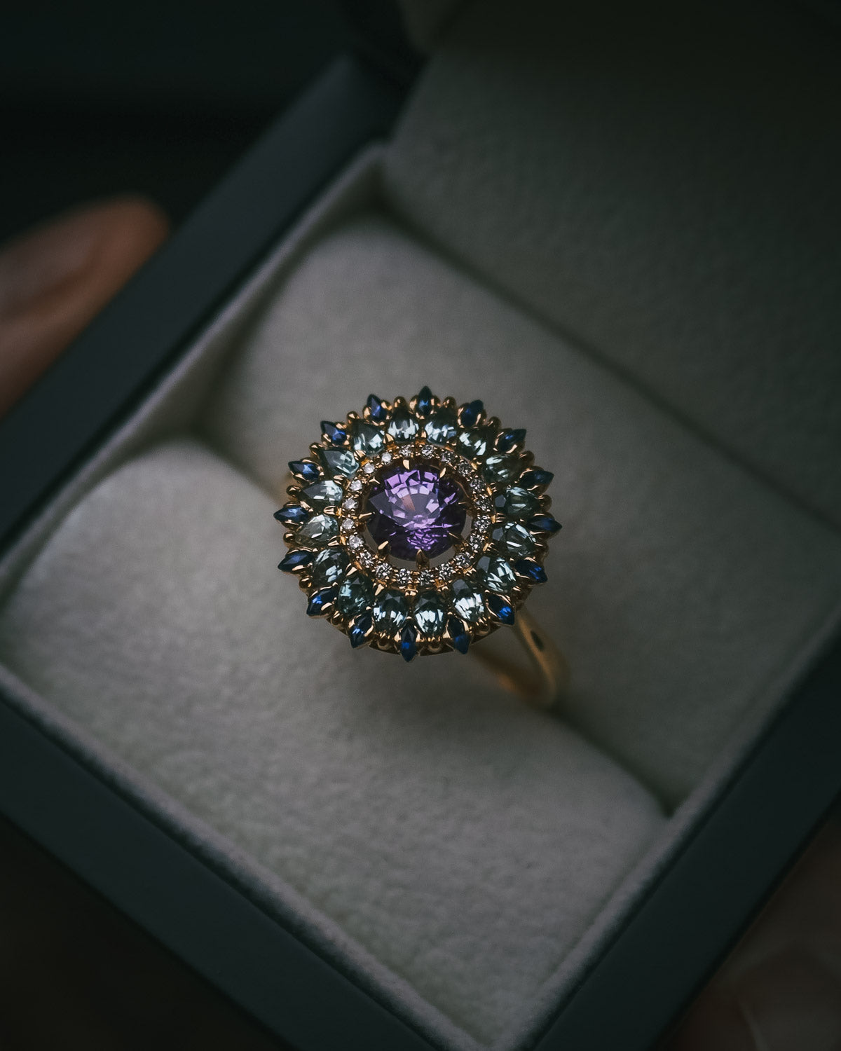Moira Patience bespoke sapphire and diamond halo engagement ring