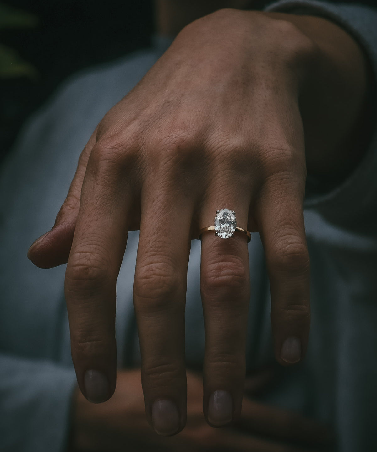 Natural diamond bespoke engagement ring on hand
