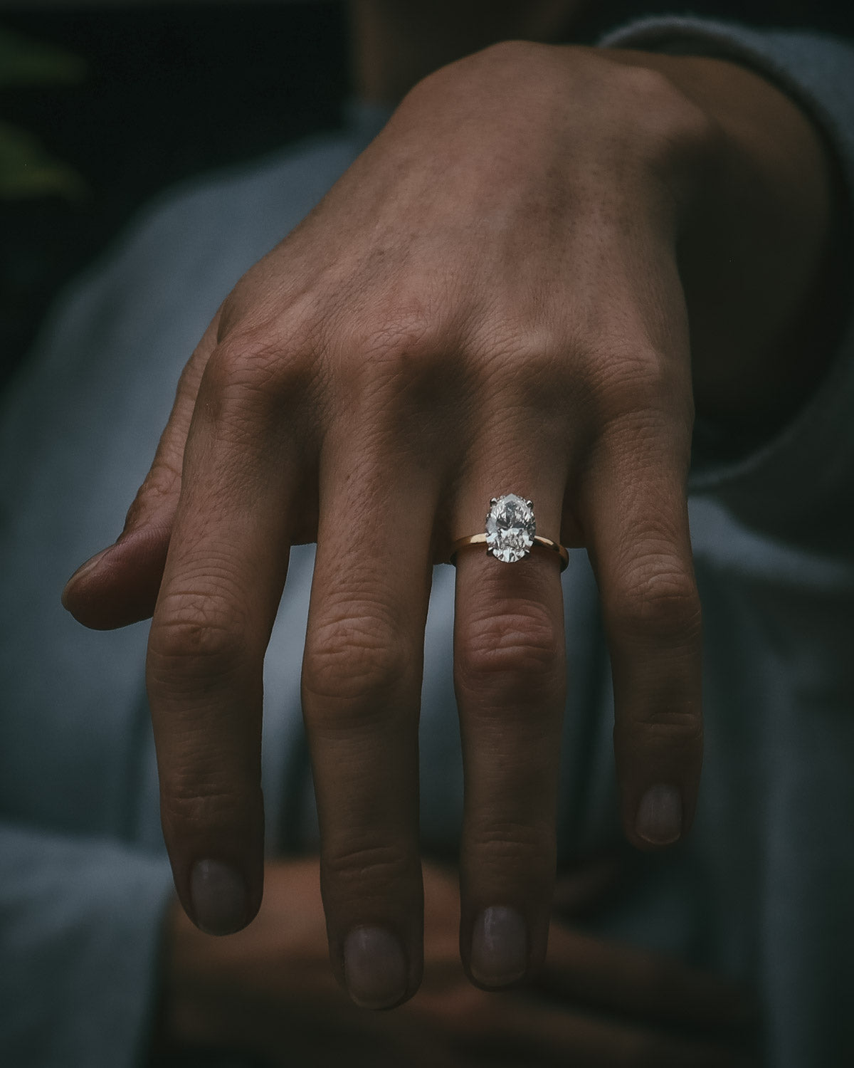 Natural diamond bespoke engagement ring on hand