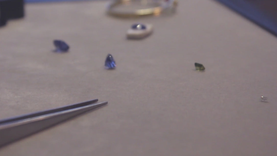 Moira Patience looking at gemstones in the showroom